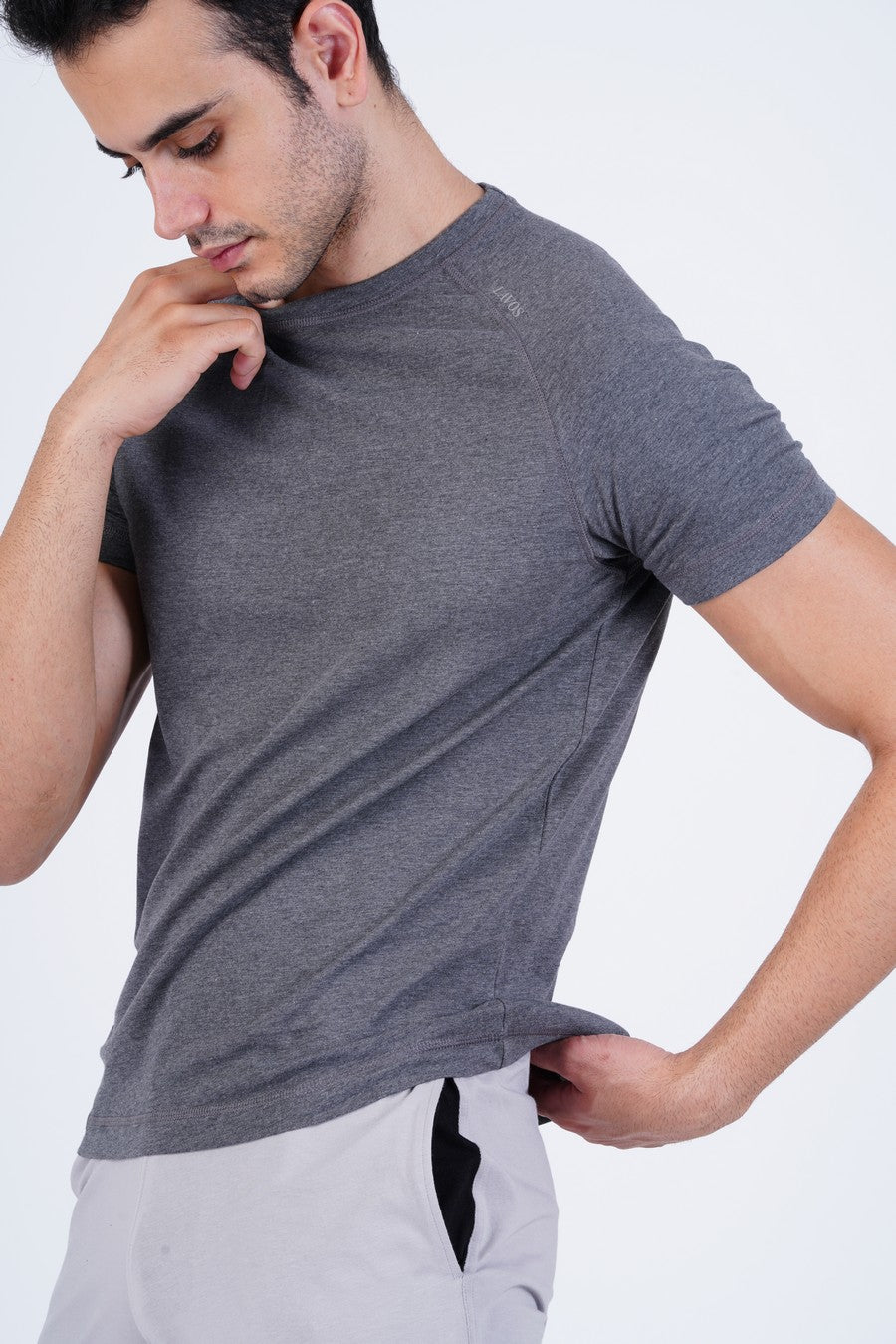 Men's Raglan T-Shirt's photograph that's made with an innovative bamboo and organic cotton fabric from Lavos Performance, a carbon neutral eco-fashion company. 